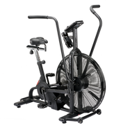 A black Assault Bike exercise machine with a large fan and adjustable seat and handlebar settings.