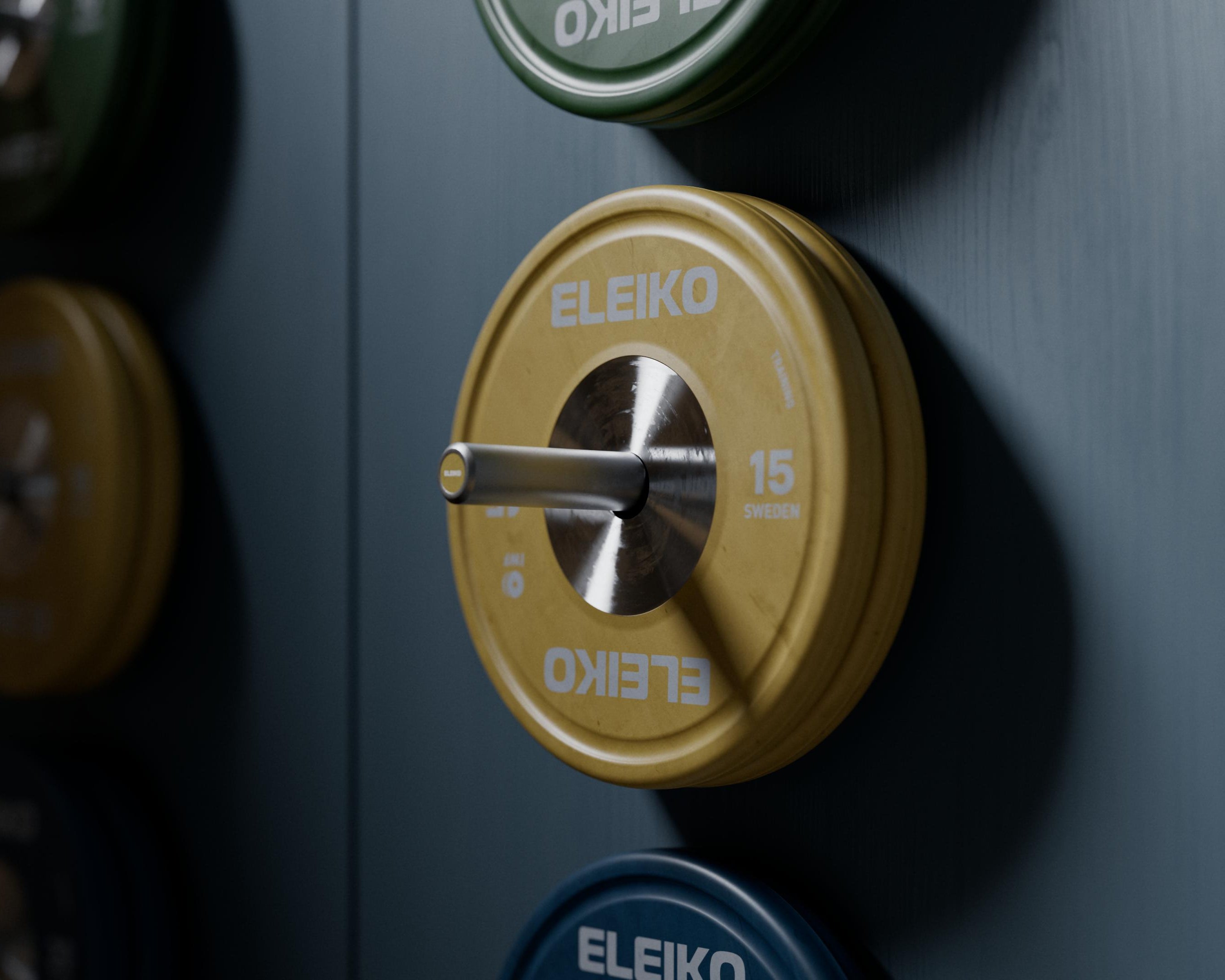 Close-up of a weightlifting plate with 'Eleiko' branding on a dark background